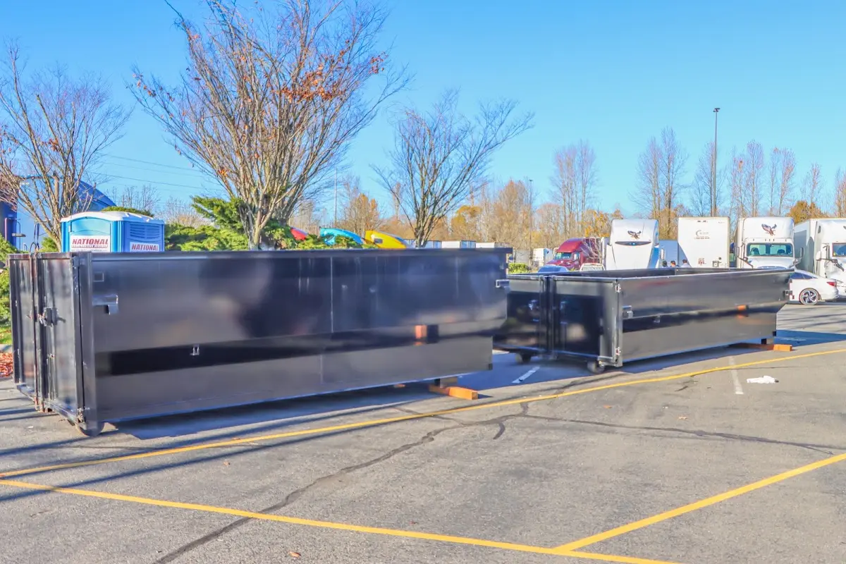 Professional dumpster rental service with roll-off container on residential driveway in Tampa